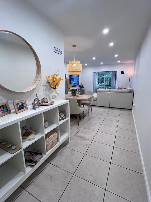 hallway with light tile patterned floors