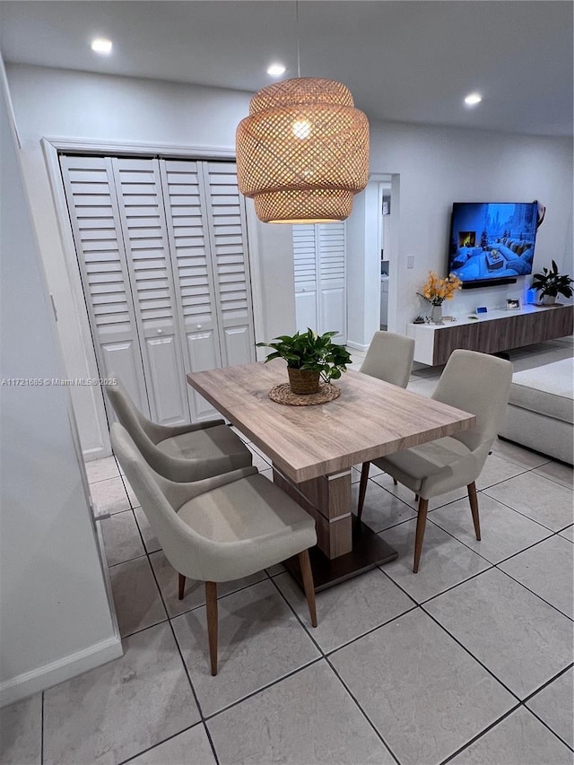 dining area featuring light tile patterned flooring