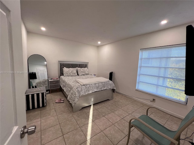 bedroom with light tile patterned flooring