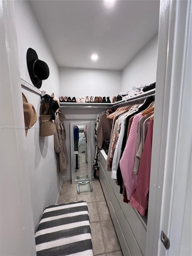 spacious closet with light tile patterned flooring