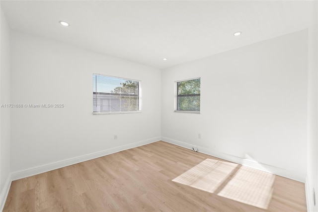 unfurnished room featuring light wood-type flooring