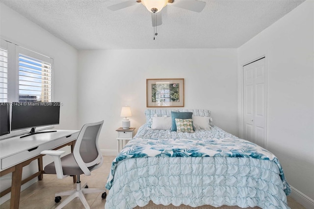 bedroom with a textured ceiling, a closet, and ceiling fan