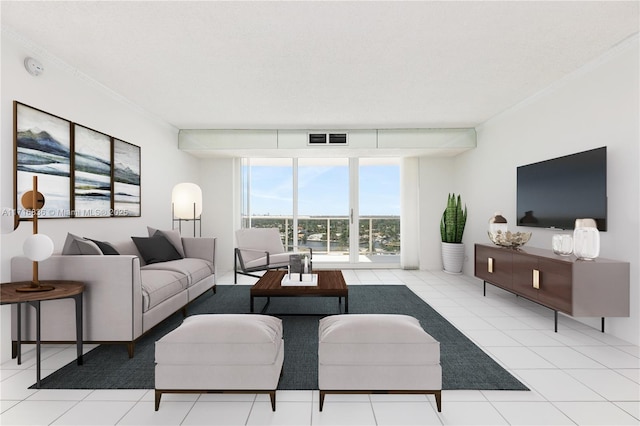 living room with a wall of windows and light tile patterned flooring