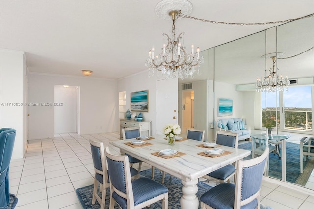 dining area featuring light tile patterned floors and crown molding