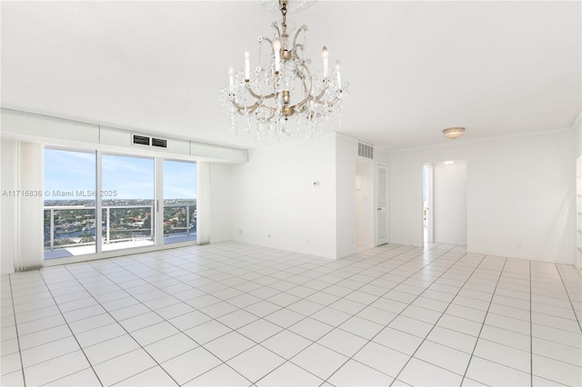 spare room featuring light tile patterned floors and a notable chandelier