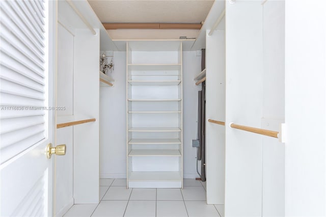 walk in closet featuring light tile patterned floors