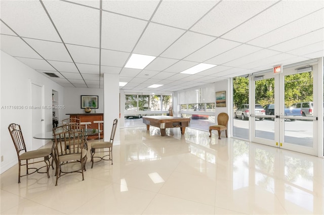 tiled dining room featuring a paneled ceiling, billiards, and french doors