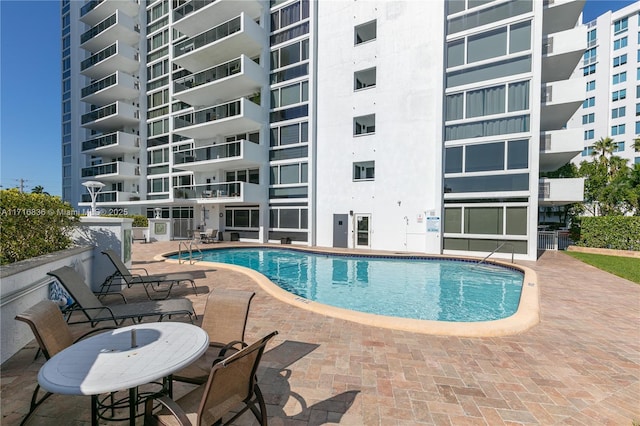 view of swimming pool with a patio area