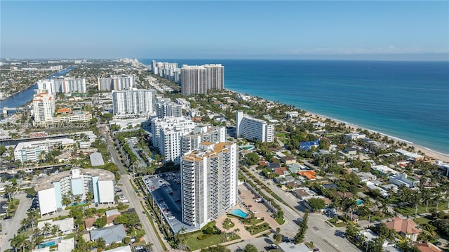 bird's eye view featuring a water view and a view of the beach