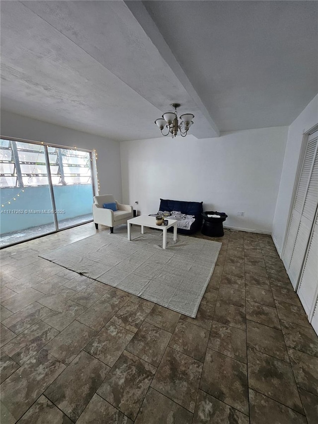 living room with a notable chandelier