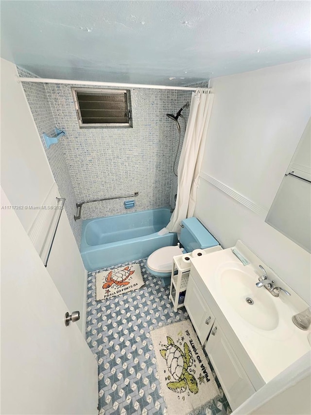 full bathroom featuring shower / tub combo, vanity, and toilet