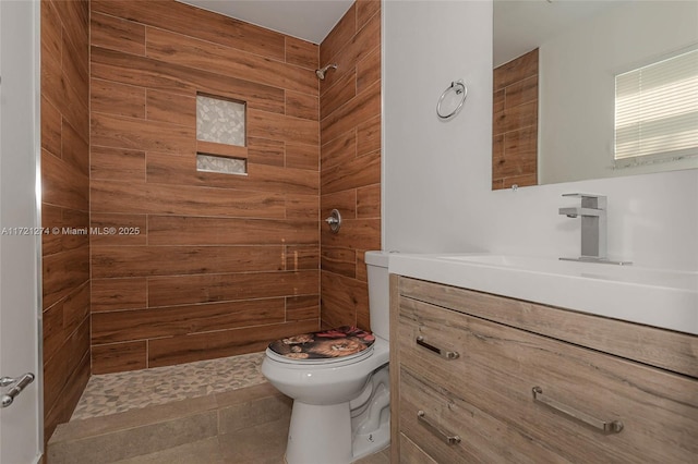 bathroom featuring vanity, toilet, and walk in shower