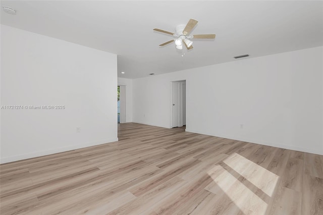 spare room with ceiling fan and light hardwood / wood-style floors