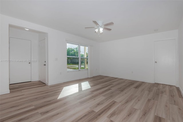 spare room with light hardwood / wood-style floors and ceiling fan