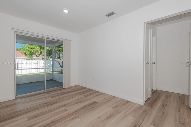 unfurnished room with light hardwood / wood-style floors