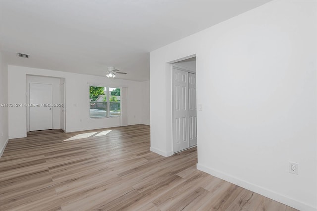 unfurnished room with light wood-type flooring and ceiling fan