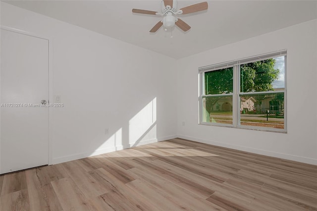 unfurnished room featuring light wood-type flooring and ceiling fan