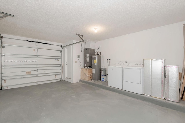 garage with washer and dryer and electric water heater