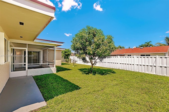 view of yard with a sunroom