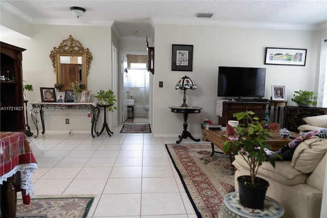 living room featuring ornamental molding, a textured ceiling, and light tile patterned floors