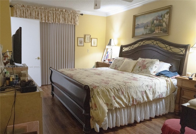 bedroom featuring ceiling fan, crown molding, and dark hardwood / wood-style floors