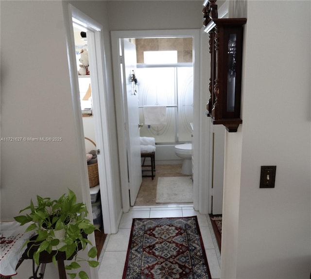 hallway with light tile patterned floors