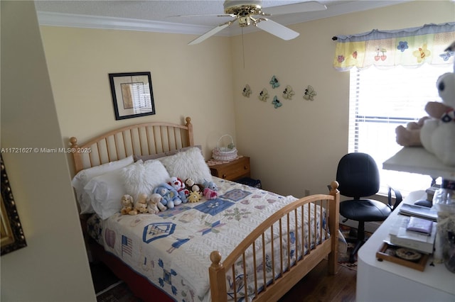 bedroom with ceiling fan, dark hardwood / wood-style flooring, and crown molding