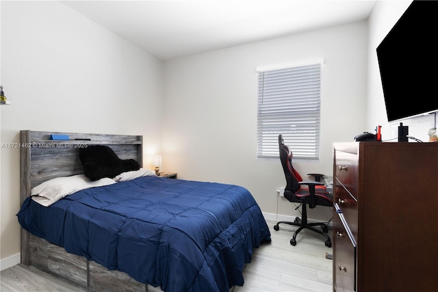 bedroom with light hardwood / wood-style floors