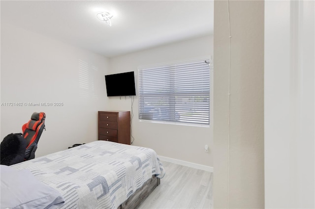 bedroom with light hardwood / wood-style flooring