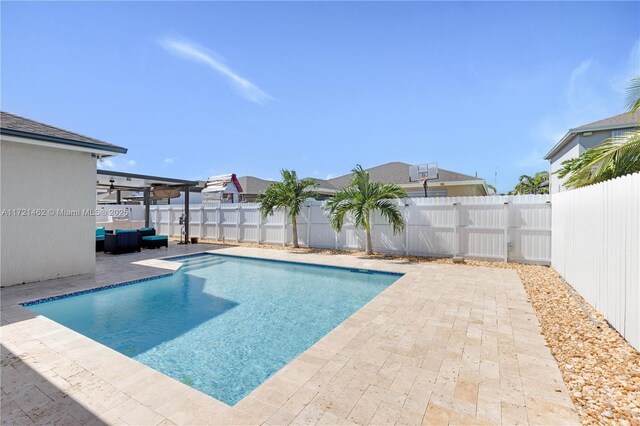 view of swimming pool featuring a patio area