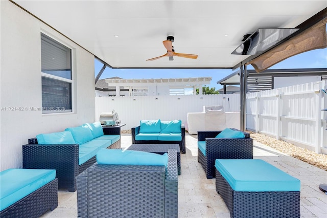 view of patio with an outdoor living space and ceiling fan