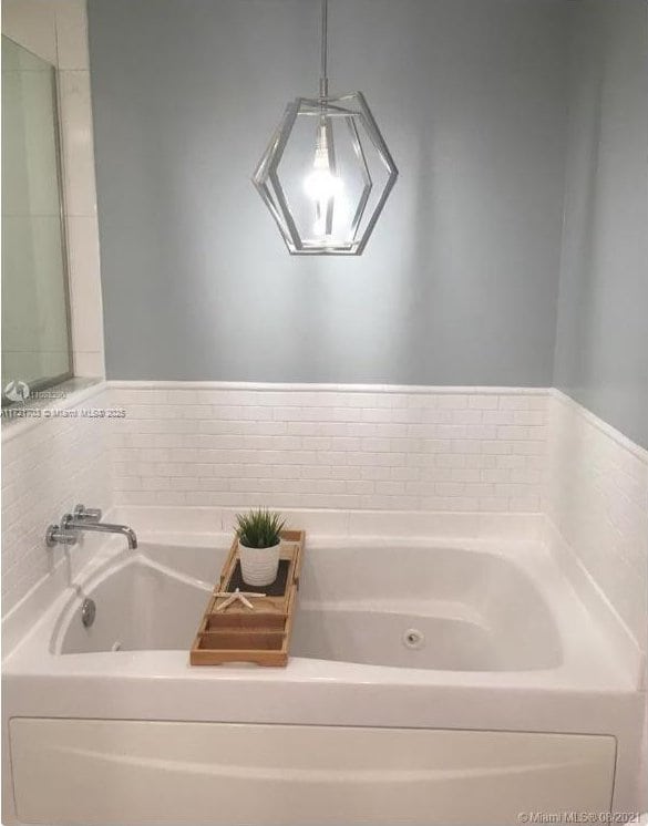 bathroom featuring a washtub