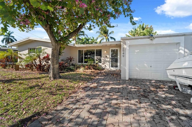 ranch-style house featuring a garage