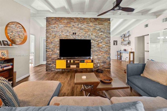 living room with hardwood / wood-style flooring, vaulted ceiling with beams, and ceiling fan