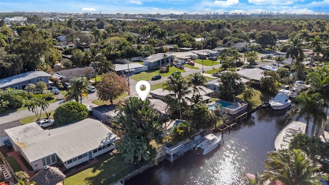 drone / aerial view with a residential view and a water view