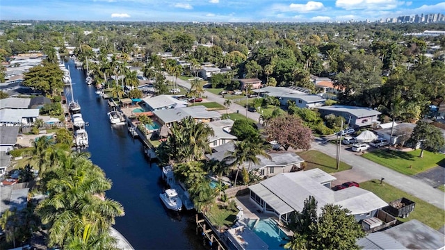 drone / aerial view featuring a residential view and a water view