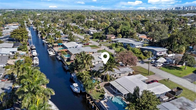 birds eye view of property featuring a residential view and a water view