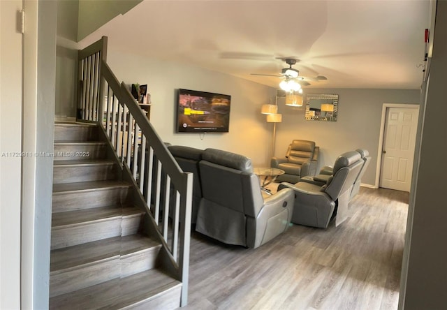 living room with hardwood / wood-style flooring and ceiling fan