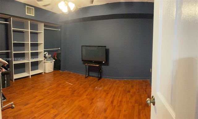 misc room featuring hardwood / wood-style floors and ceiling fan