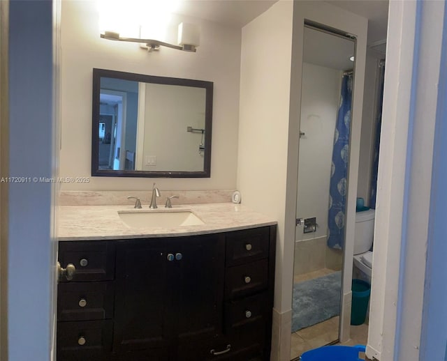 bathroom with tile patterned flooring, vanity, toilet, and curtained shower