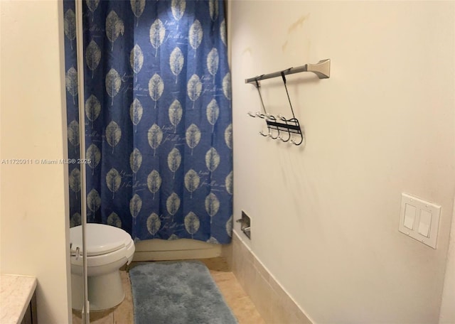 full bathroom with tile patterned floors, vanity, shower / bath combination with curtain, and toilet