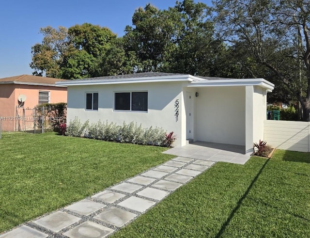 ranch-style home with a front yard