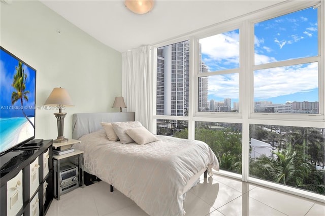 tiled bedroom with expansive windows