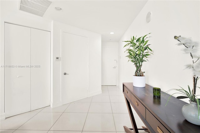 hallway featuring light tile patterned flooring