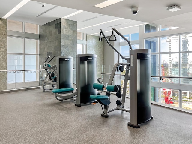 workout area featuring floor to ceiling windows