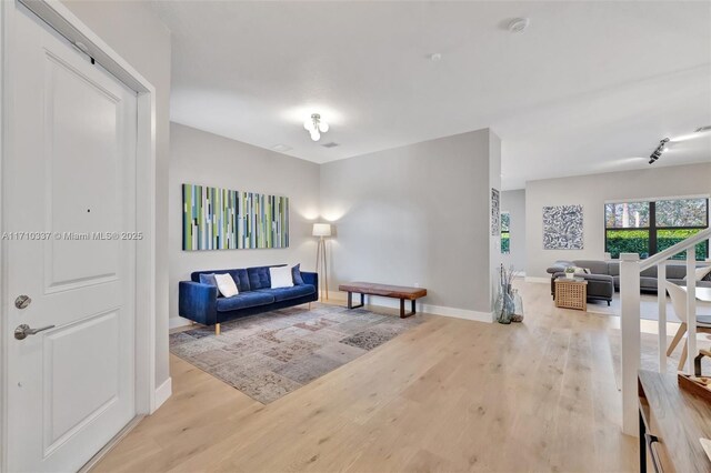 living room with light hardwood / wood-style flooring