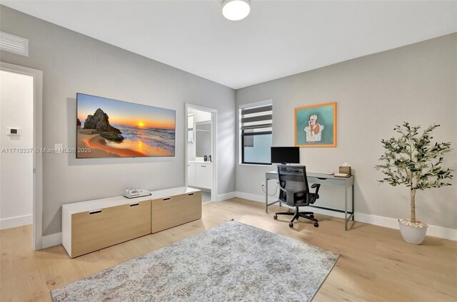 office area with light wood-type flooring