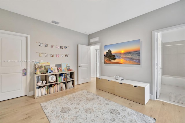 bedroom with light hardwood / wood-style floors