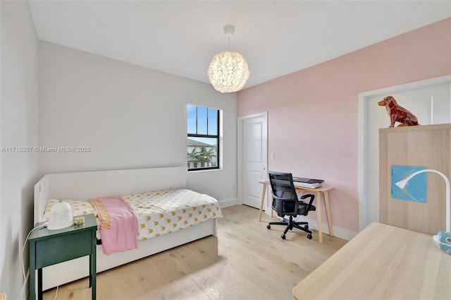 bedroom with hardwood / wood-style flooring