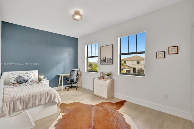 bedroom featuring light wood-type flooring